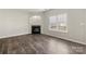 Bright living room with hardwood floors, fireplace and large window at 19531 Deer Valley Dr, Cornelius, NC 28031