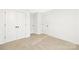 Neutral bedroom featuring carpeted floors, crisp white walls, and a double-door closet at 2117 Gemway Dr, Charlotte, NC 28216
