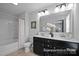 Bathroom with double vanity, modern fixtures, and a bathtub with a shower at 2302 E Main St # 1P, Albemarle, NC 28001