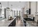 Well-lit kitchen with granite countertops, stainless steel appliances, and a view into the dining area at 2302 E Main St # 1P, Albemarle, NC 28001