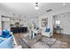 Open-concept living space with a kitchen, living room, and dining area, creating a cohesive living area at 2302 E Main St # 1P, Albemarle, NC 28001