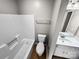 Well-lit bathroom features a shower-tub combo and a modern vanity with ample counter space at 2507 Kilborne Dr # H, Charlotte, NC 28205