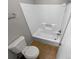 Clean bathroom with neutral tile flooring, updated toilet and shower/tub combination at 2507 Kilborne Dr # H, Charlotte, NC 28205