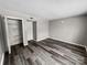 Bedroom with vinyl floors, closet, and clean design at 2507 Kilborne Dr # H, Charlotte, NC 28205