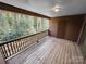 Outdoor deck with wooden floor and railings perfect for relaxing and enjoying the greenery at 2507 Kilborne Dr # H, Charlotte, NC 28205