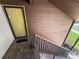 Exterior entryway with a yellow front door and wooden steps, creating a welcoming entrance at 2507 Kilborne Dr # H, Charlotte, NC 28205