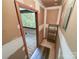 Hallway under renovation with access to a porch; showcasing the fixer-upper potential at 2507 Kilborne Dr # H, Charlotte, NC 28205