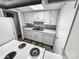 Functional kitchen includes modern appliances, ample cabinet space, and laminate flooring at 2507 Kilborne Dr # H, Charlotte, NC 28205