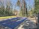 Pool in the backyard covered for the off-season, surrounded by trees, showing backyard at 2507 Kilborne Dr # H, Charlotte, NC 28205