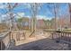 Wood deck overlooking an expansive backyard and mature trees at 2913 Ashley Woods Ct, Monroe, NC 28112