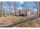 View of home and back yard with mature trees at 2913 Ashley Woods Ct, Monroe, NC 28112