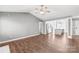 Open-concept living space featuring hardwood floors, gray walls, and stainless steel appliances at 2913 Ashley Woods Ct, Monroe, NC 28112