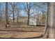 Exterior view of shed in tree-lined backyard at 2913 Ashley Woods Ct, Monroe, NC 28112