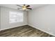 Cozy bedroom featuring a ceiling fan and a large window that allows ample natural light to brighten the space at 307 Rose Garden Ct, Rock Hill, SC 29732