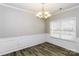 Elegant dining room featuring wainscoting, a modern chandelier, and lots of light at 307 Rose Garden Ct, Rock Hill, SC 29732
