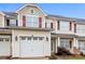 Inviting townhome with a one-car garage, red shutters, and a well-kept exterior at 307 Rose Garden Ct, Rock Hill, SC 29732