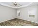 Spacious main bedroom with a tray ceiling, ceiling fan, and two windows at 307 Rose Garden Ct, Rock Hill, SC 29732
