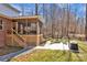 The backyard showcases a screened porch, fire pit area, and lush lawn, perfect for outdoor living and entertaining at 320 Heritage Pl, Mooresville, NC 28115