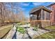 Backyard featuring a cozy fire pit area and covered porch at 320 Heritage Pl, Mooresville, NC 28115