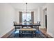 Bright dining room features a wooden table, bench, and modern lighting at 320 Heritage Pl, Mooresville, NC 28115
