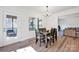 Inviting dining area with views of a screened porch and open access to the living room at 320 Heritage Pl, Mooresville, NC 28115