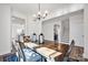 Dining room with stairs and an open view of the modern kitchen at 320 Heritage Pl, Mooresville, NC 28115