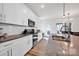 Modern kitchen with stainless steel appliances, granite countertops, and ample cabinet space at 320 Heritage Pl, Mooresville, NC 28115