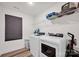 This laundry room has modern appliances and a convenient storage shelf at 320 Heritage Pl, Mooresville, NC 28115