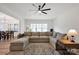 Open-concept living room with large sectional sofa, area rug, and natural light at 320 Heritage Pl, Mooresville, NC 28115