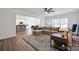 Open concept living room connects seamlessly to the kitchen and dining area at 320 Heritage Pl, Mooresville, NC 28115