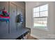 Well-organized mudroom with storage bench, hooks, and natural light at 320 Heritage Pl, Mooresville, NC 28115