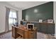 Comfortable home office with a large desk, storage cabinets, and natural light at 320 Heritage Pl, Mooresville, NC 28115