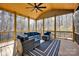 The screened porch offers a comfortable outdoor space with wicker furniture, perfect for relaxing and enjoying the view at 320 Heritage Pl, Mooresville, NC 28115