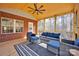 Relax in style on this covered porch, featuring comfortable seating and wood floors at 320 Heritage Pl, Mooresville, NC 28115