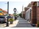 A view of the street with charming architecture and pedestrian-friendly sidewalks shows the neighborhood's appeal at 320 Heritage Pl, Mooresville, NC 28115