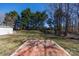 Expansive backyard featuring a brick patio area, ideal for outdoor living, and a storage shed for convenience at 3507 Sassafras Trl, Waxhaw, NC 28173