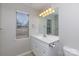 Bathroom featuring a vanity, toilet, and large mirror, with natural light from the window at 3507 Sassafras Trl, Waxhaw, NC 28173