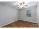A cozy bedroom with a ceiling fan, one window, wood-look floors, and neutral-painted walls at 3507 Sassafras Trl, Waxhaw, NC 28173