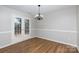Dining room featuring wood floors and French doors leading to the backyard at 3507 Sassafras Trl, Waxhaw, NC 28173