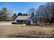 Attractive single-story home with a cozy front porch, complemented by lush greenery and a peaceful atmosphere at 3507 Sassafras Trl, Waxhaw, NC 28173