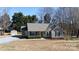 Inviting home featuring a covered front porch, neat landscaping, and a storage shed on a spacious lot at 3507 Sassafras Trl, Waxhaw, NC 28173