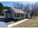 Attractive single-story home with a cozy front porch and well-kept landscaping, nestled in a quiet neighborhood at 3507 Sassafras Trl, Waxhaw, NC 28173
