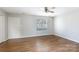 Bright living room featuring wood-look flooring, a window for natural light, and neutral wall paint at 3507 Sassafras Trl, Waxhaw, NC 28173