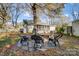 Charming backyard with stone fire pit and seating area, perfect for outdoor entertaining at 3800 Craig Ave, Charlotte, NC 28211