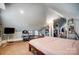 Well lit bedroom featuring a sloped ceiling, neutral walls, and warm, inviting carpeting at 3800 Craig Ave, Charlotte, NC 28211