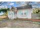 Quaint home featuring pastel blue shutters and a brick facade, adding to its curb appeal at 3800 Craig Ave, Charlotte, NC 28211