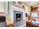 Charming fireplace with decorative blue tile, located between the living room and the dining room at 3800 Craig Ave, Charlotte, NC 28211