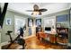 This home office features hardwood floors, neutral paint and memorabilia that adds character at 3800 Craig Ave, Charlotte, NC 28211