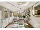 Charming screened in porch with string lights, outdoor dining table, and views of the yard at 3800 Craig Ave, Charlotte, NC 28211