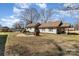 Spacious backyard with a patio area perfect for entertaining and relaxation, showcasing a well-maintained lawn at 400 37Th Sw St, Hickory, NC 28602